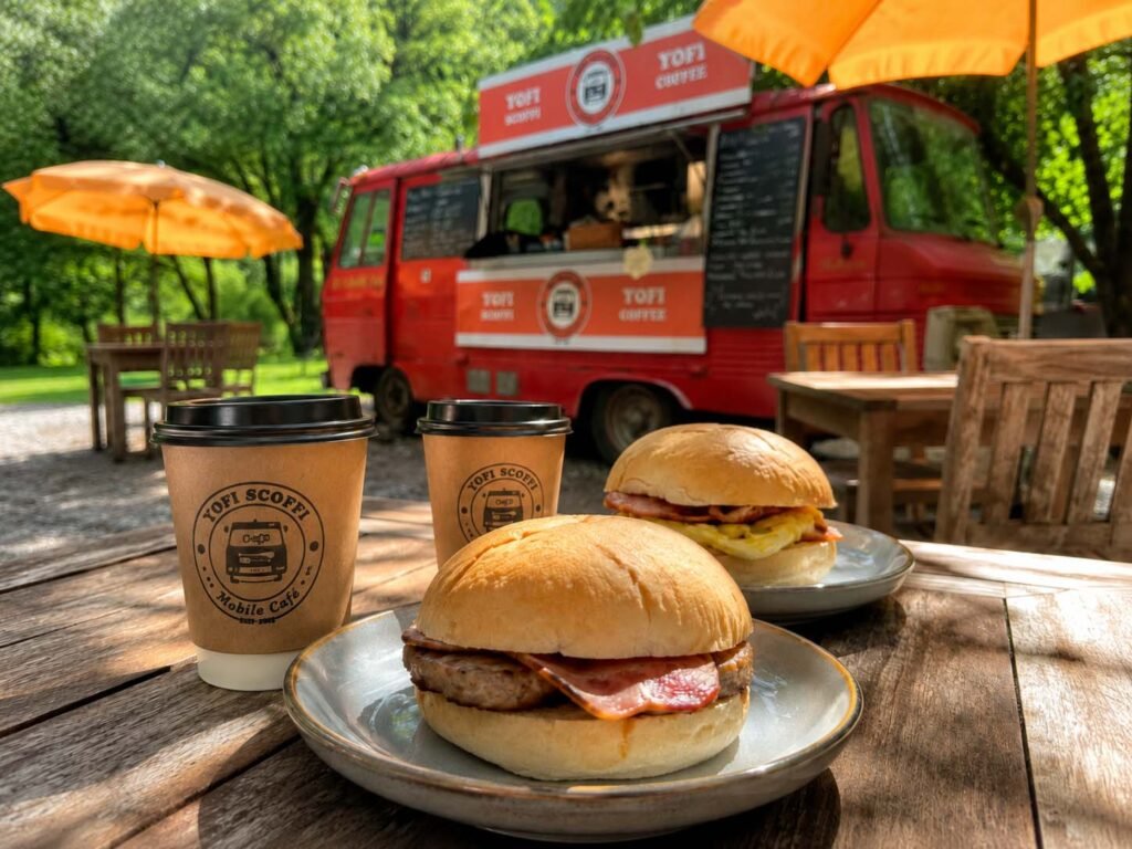 Bacon and sausage breakfast baps with YOFI Scoffi coffee at YOFI Paddle Cafe