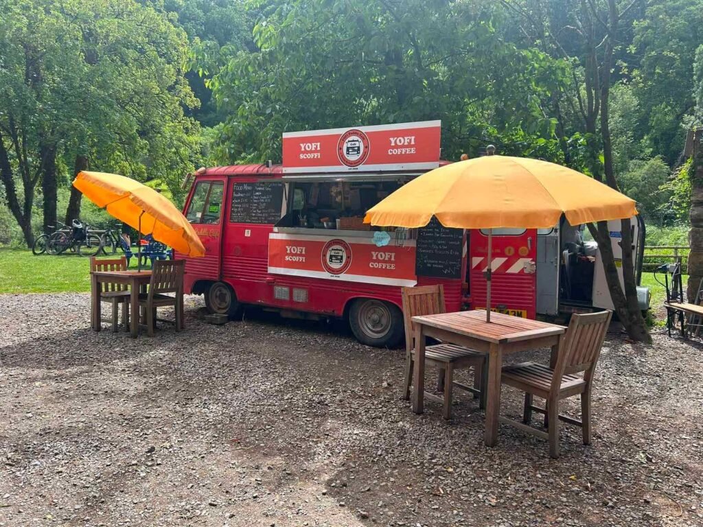 YOFI Paddle Cafe food truck with outdoor seating by the River Wye at Kerne Bridge